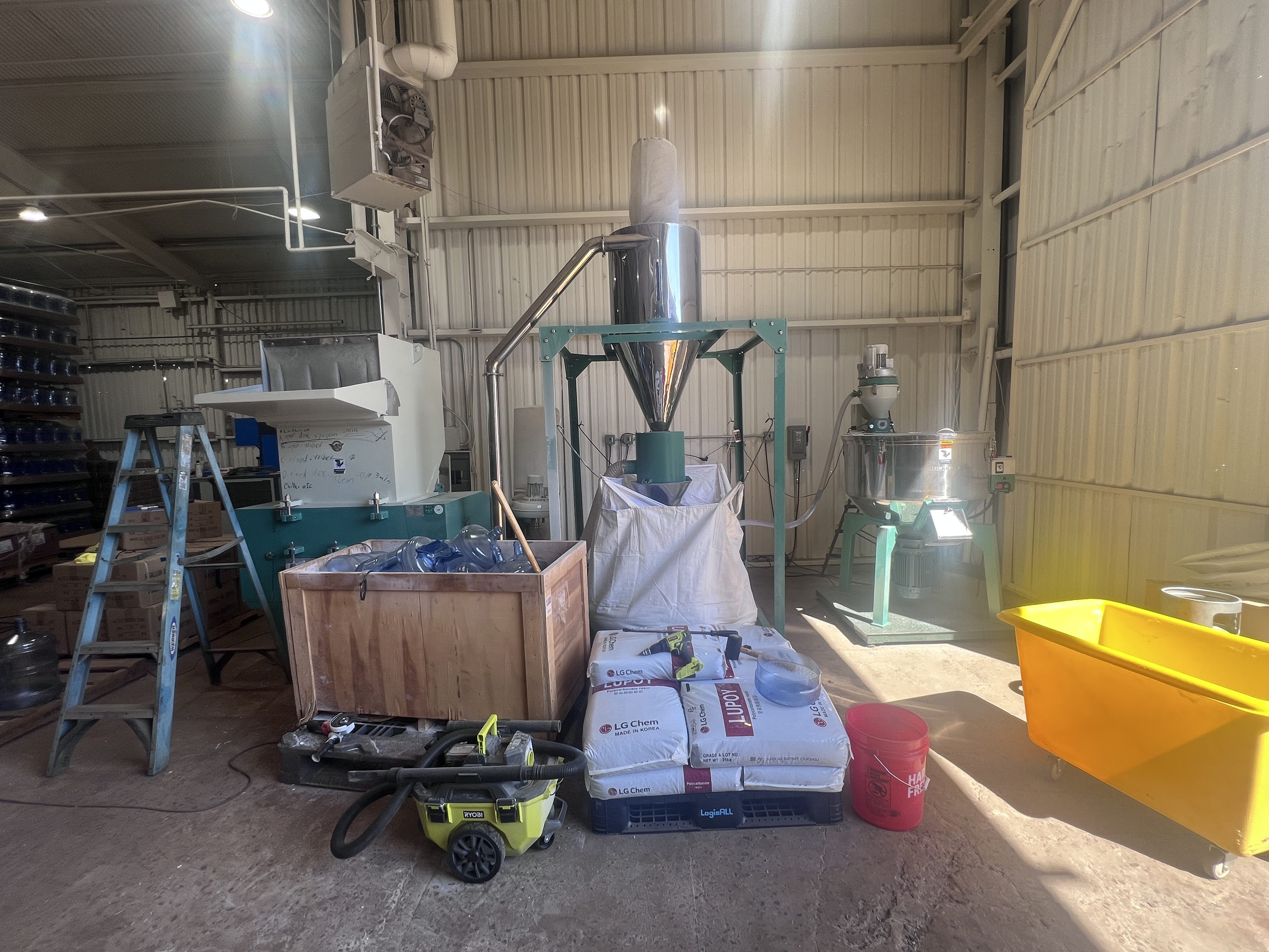 Plastics granulator and stainless cyclone separator before RP1 installation at Arizona polycarbonate bottle manufacturer