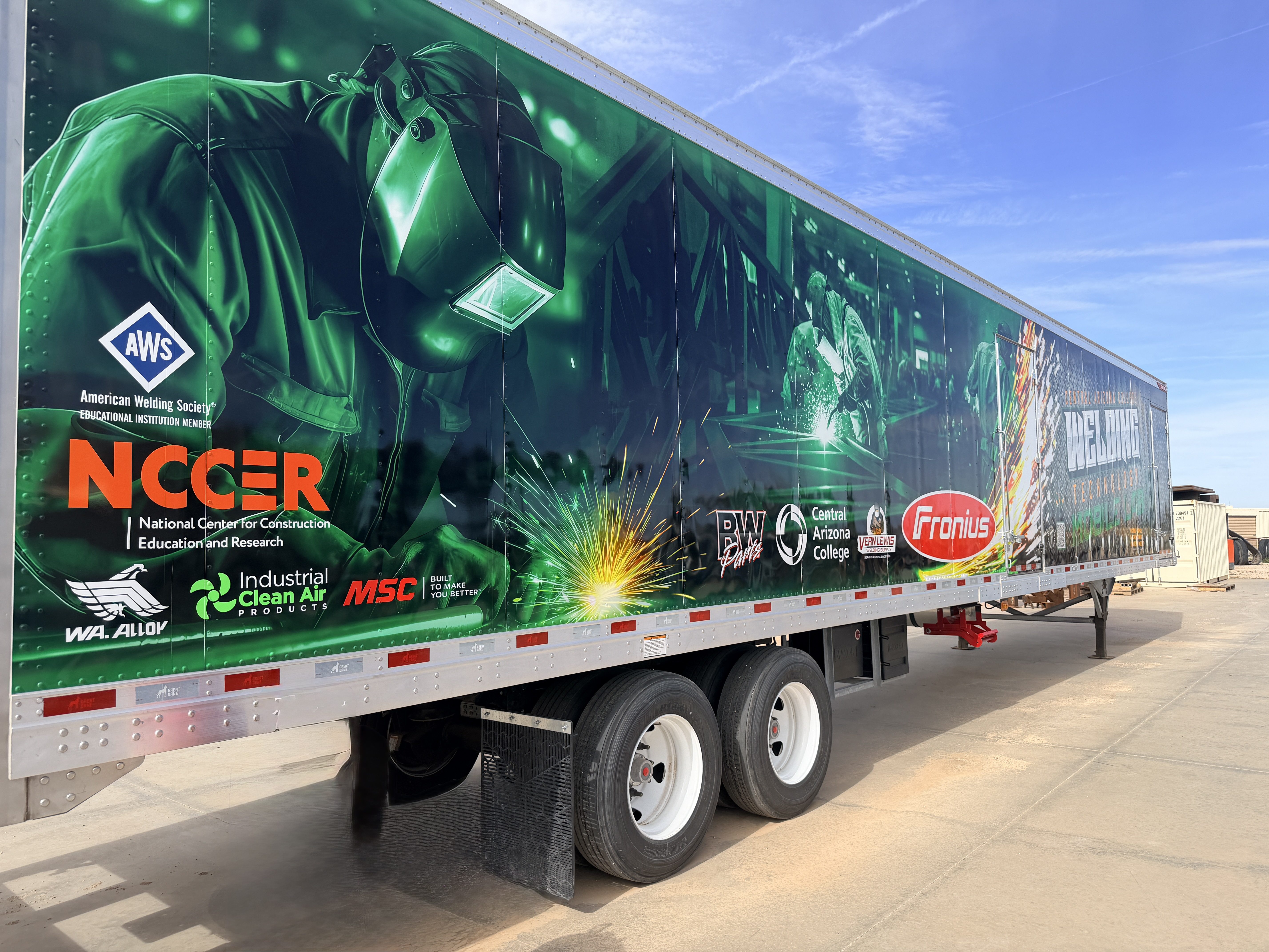 Exterior of Central Arizona College's mobile welding lab trailer featuring the Industrial Clean Air Products logo