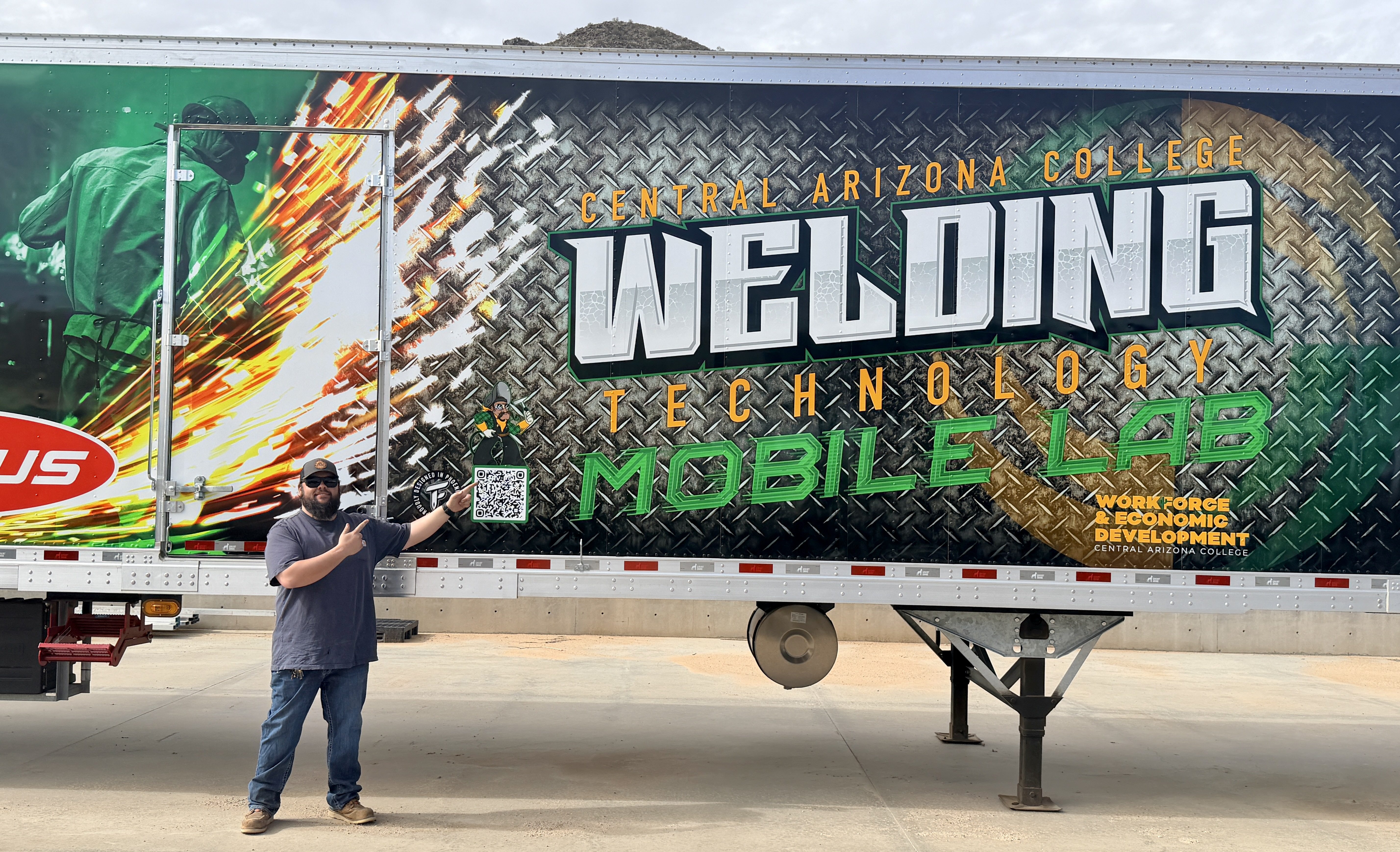 Jordan Porterfield standing in front of the Central Arizona College mobile welding lab trailer